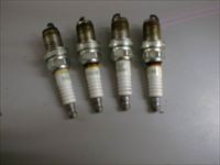 Traces of corrosion over two spark plugs